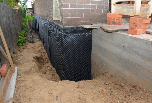 Happy homeowners after waterproofing job in Brookwood